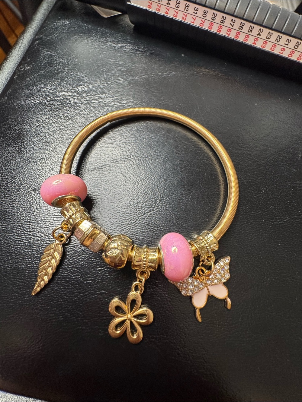 Gold-Tone Charm Bangle Bracelet with Pink Beads
